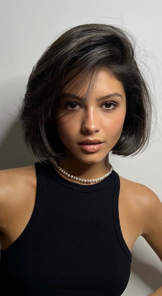 Textured Dark Brown Bob With Wispy Bangs Textured Dark Brown Bob With Wispy Bangs — Trendy Shoulder Length Bob