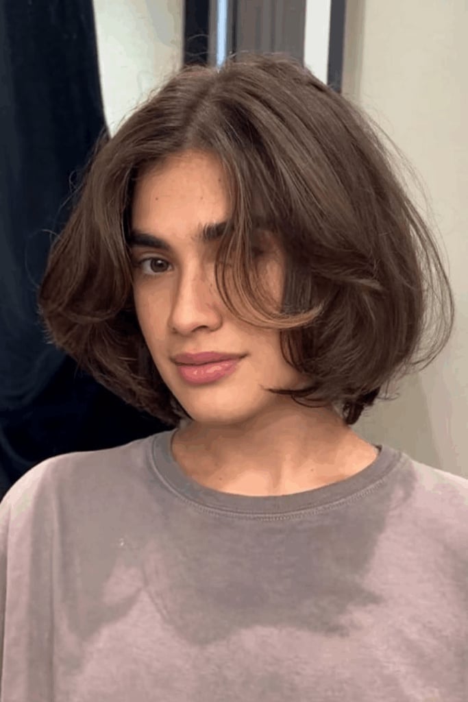 Medium Brown Collarbone Bob With Curtain Bangs Medium Brown Collarbone Bob With Curtain Bangs — Trendy Shoulder Length Bob
