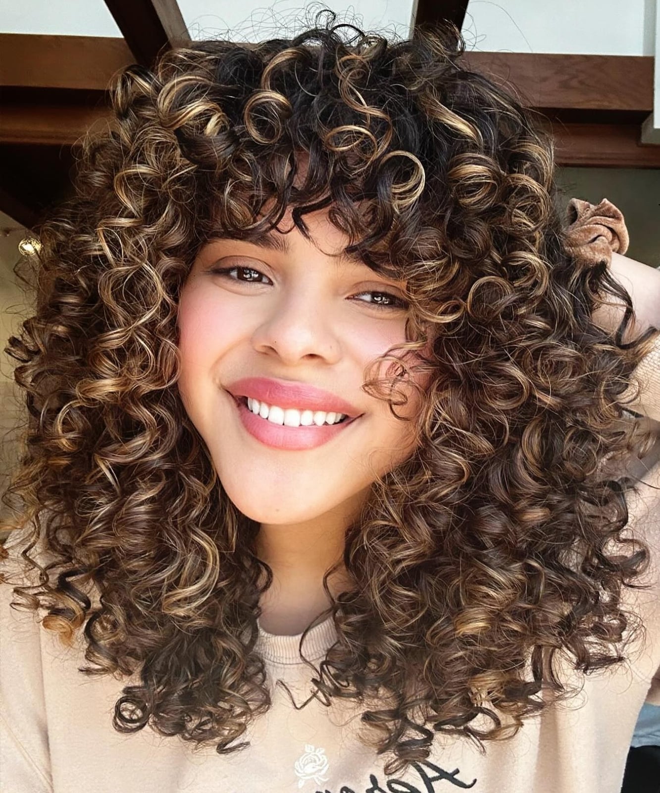 Polished Shoulder Length Cut With Full Bangs — Trendy Shoulder Length Curly Hair