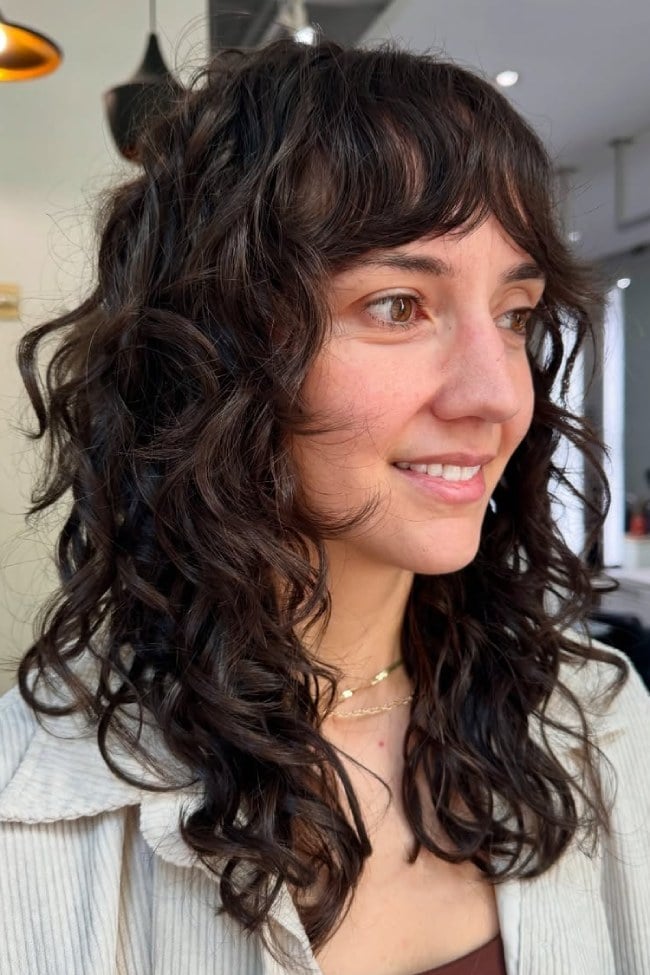 Medium Shag With Soft Fringe And Face-Framing Layers — Trendy Shoulder Length Curly Hair