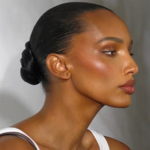Sleek Dark Brown Low Bun With Long Layers — Trendy Slick Back Hairstyles