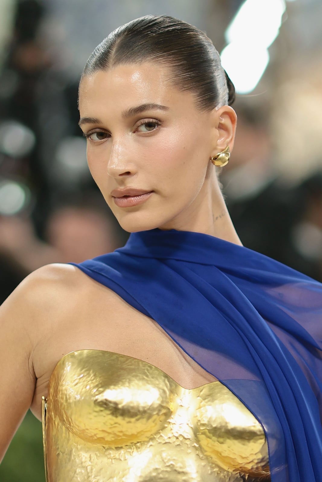 Polished Dark Brown Bun From Middle Part — Trendy Slick Back Hairstyles