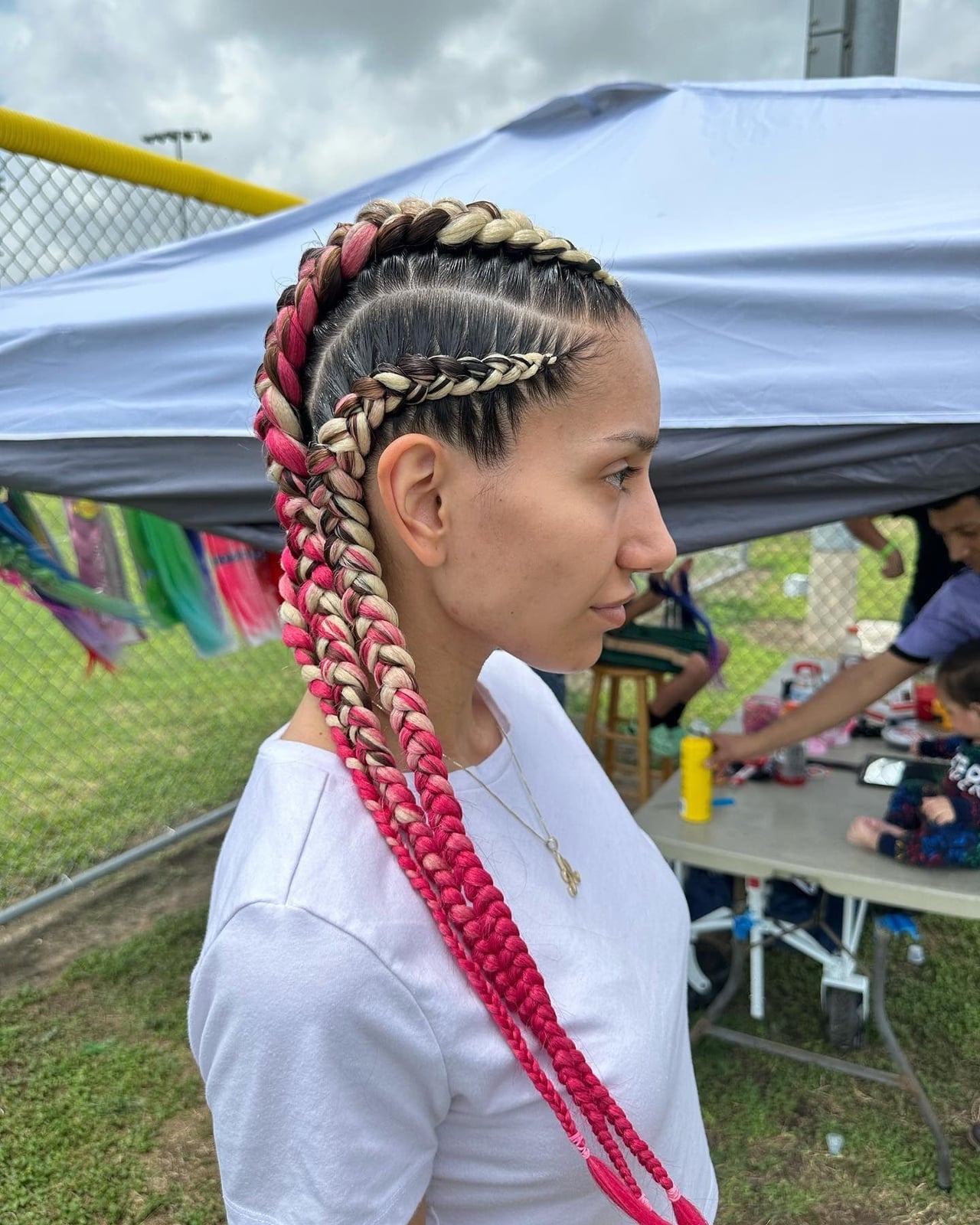 Blonde and Black Braided Mohawk With Pink and Red Blonde and Black Braided Mohawk With Pink and Red — Trendy Softball Hair
