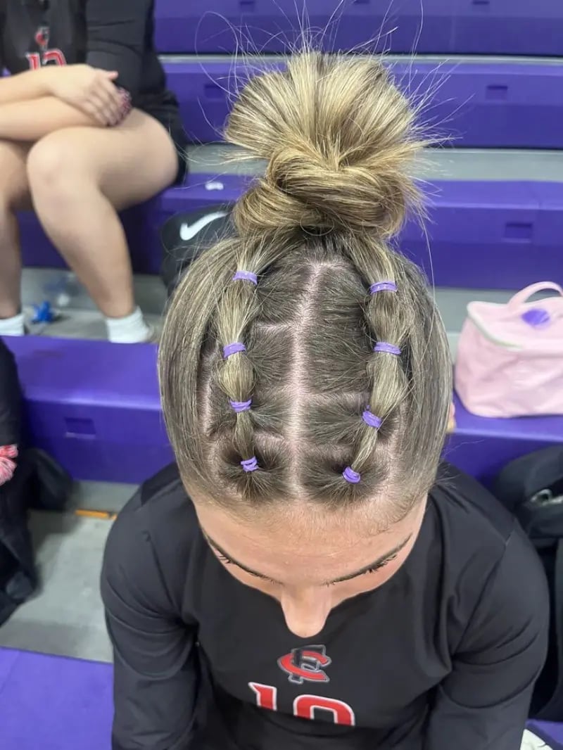 Blonde Bun With Four Braided Sections Blonde Bun With Four Braided Sections — Trendy Softball Hair