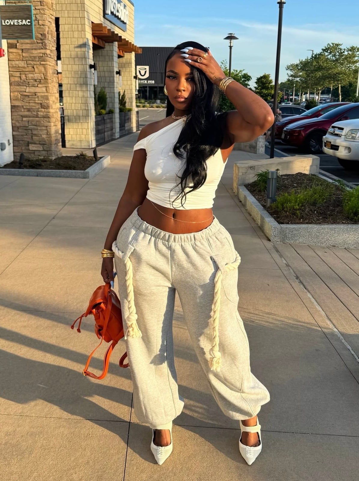 Grey Baggy Sweatpants with One-Shoulder Crop Top and Heels — Trendy Sweatpants Outfits