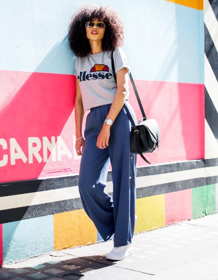 Grey Graphic Tee With Navy Wide Leg Trousers And Sneakers — Trendy Tomboy Outfits