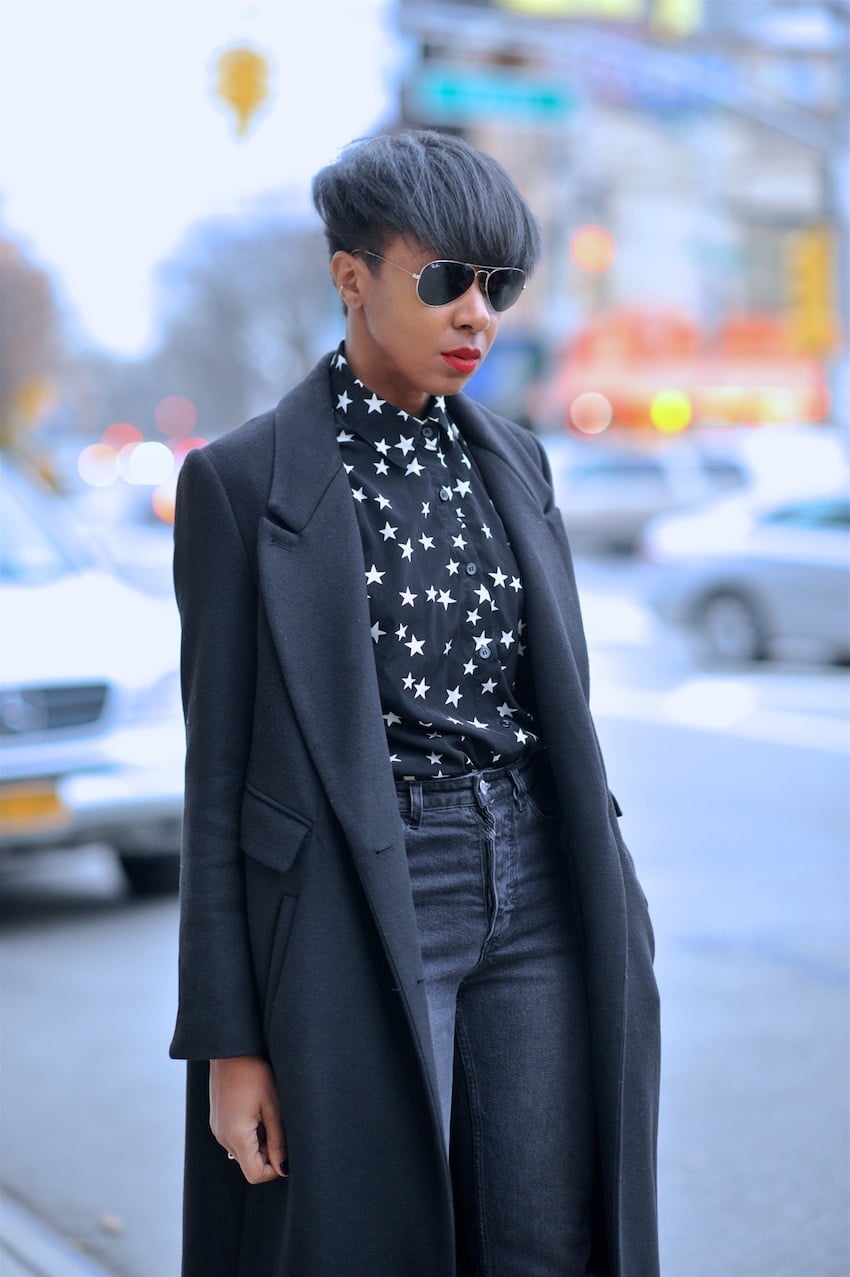Black Coat Over Star Print Shirt With Straight Leg Jeans — Trendy Tomboy Outfits