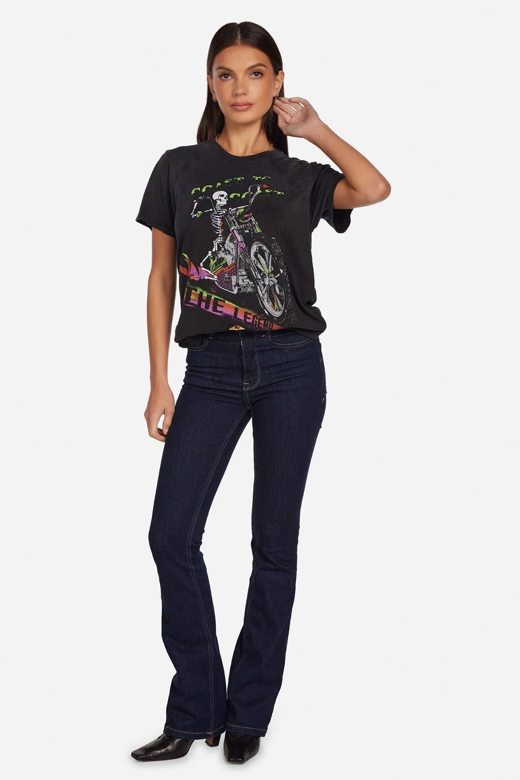 Skeleton Graphic Tee With Flared Jeans And Pointed Heels — Trendy Tomboy Outfits