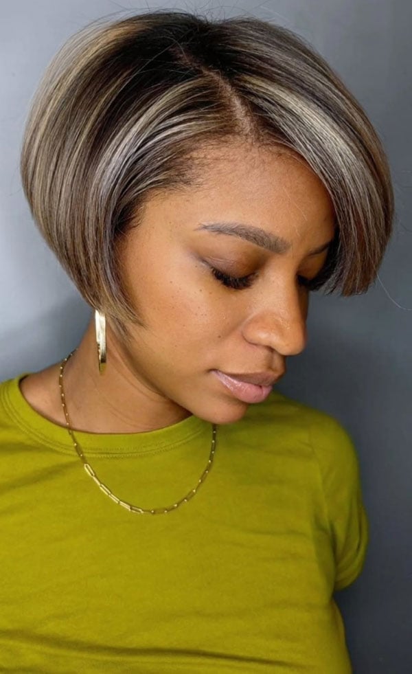 Chin Length Bob With Side Swept Bangs And Blonde Highlights — Trendy Twist Bob