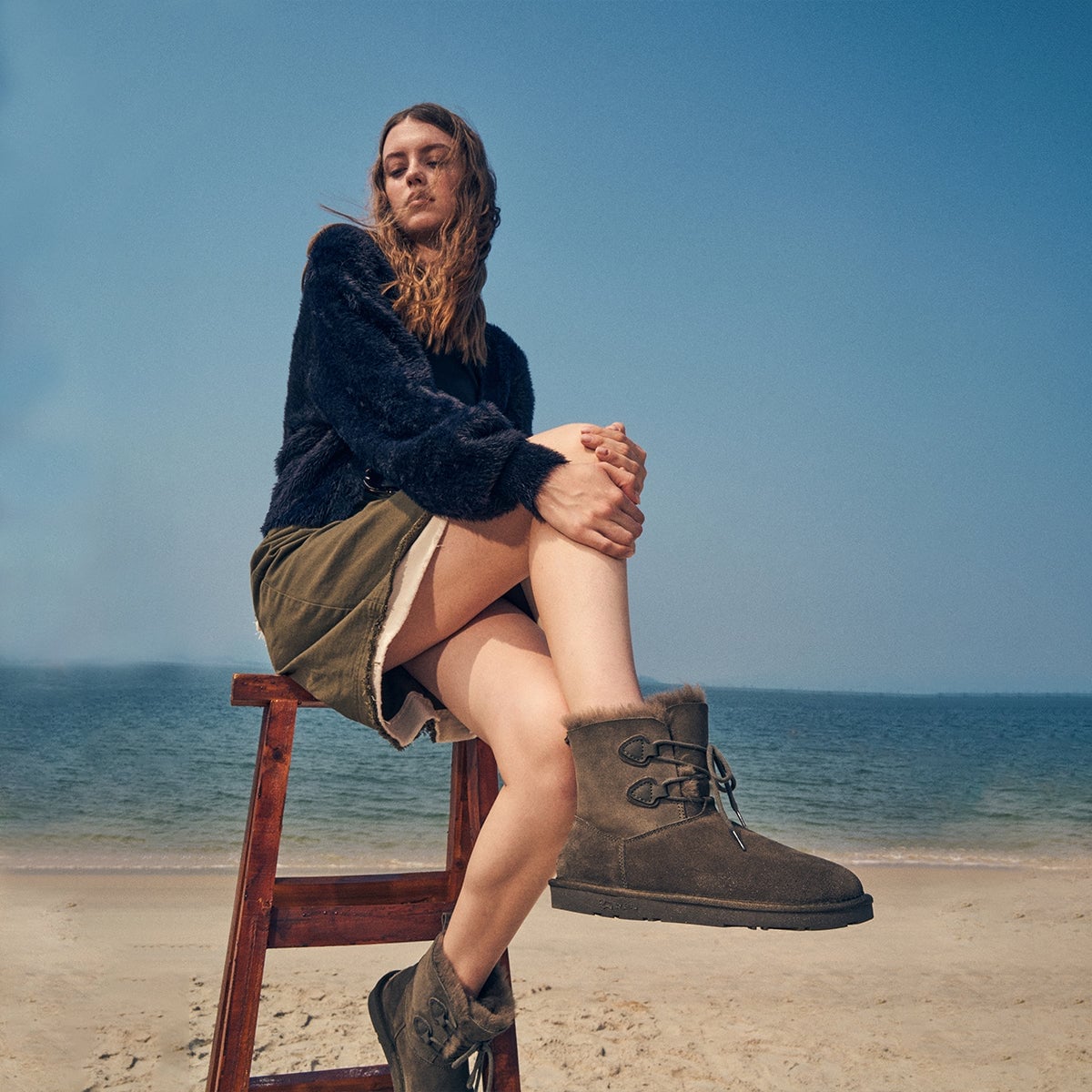 Dark Green Ugg Boots with Shearling Skirt and Fuzzy Sweater — Trendy Uggs Outfits