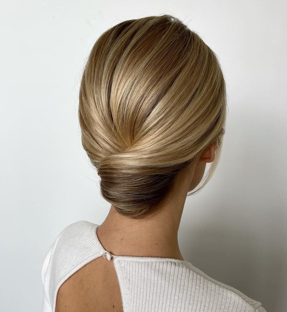 Blonde Sleek Sculpted Chignon Blonde Sleek Sculpted Chignon — Trendy Wedding Guest Updos