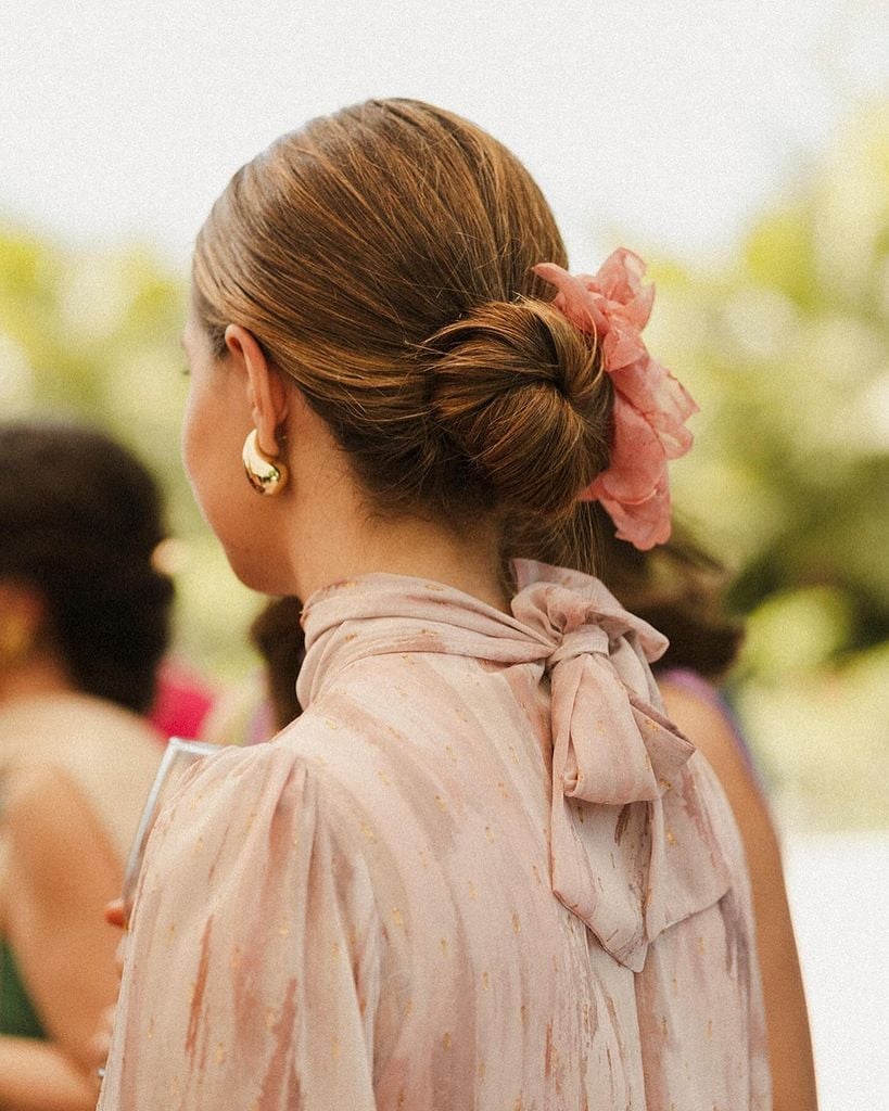 Medium Brown Loose Textured Bun Medium Brown Loose Textured Bun — Trendy Wedding Guest Updos