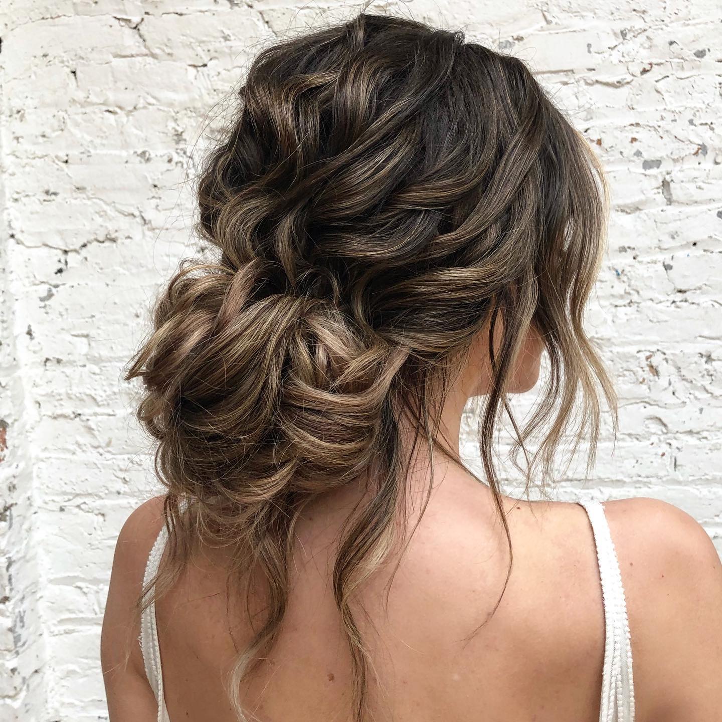 Long Dark Brown Balayage Voluminous Low Bun Long Dark Brown Balayage Voluminous Low Bun — Trendy Wedding Guest Updos