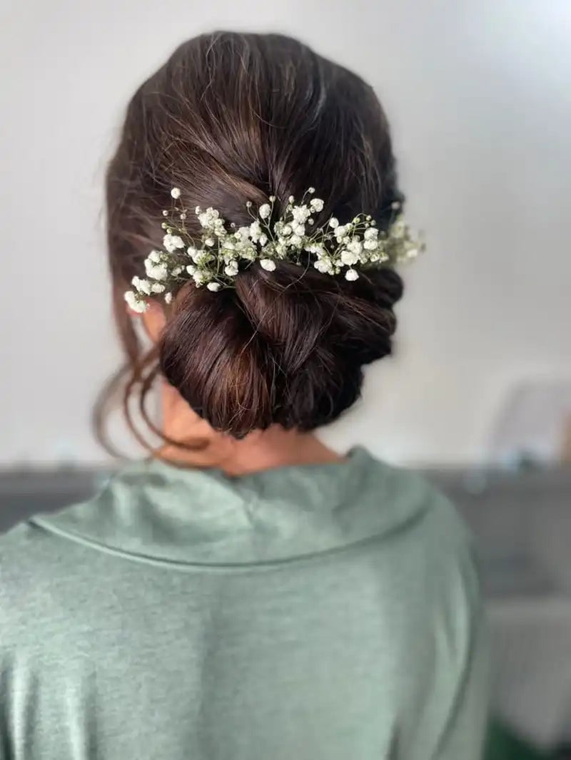 Dark Brown Low Bun With Baby's Breath — Trendy Wedding Hair
