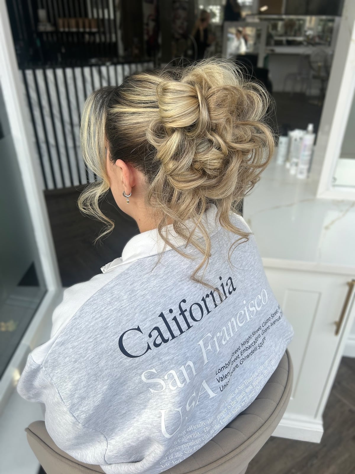 Textured Blonde Messy Bun With Curls — Trendy Wedding Hair