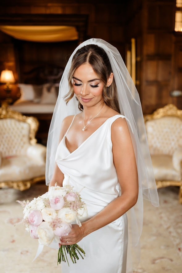 Sleek Dark Brown Chin Length Bob Low Bun — Trendy Wedding Hair