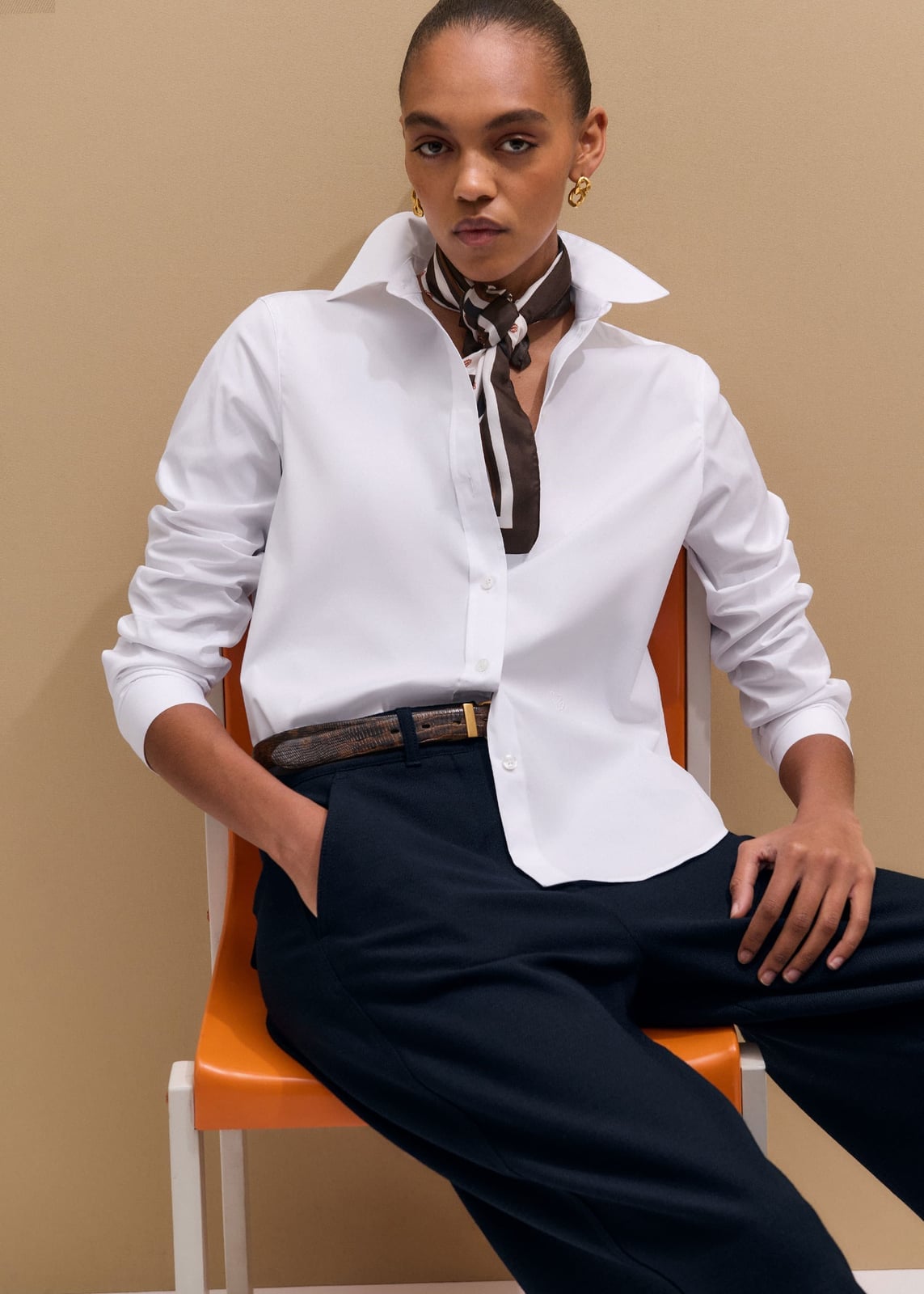 Crisp White Shirt Tucked into Navy Trousers with Scarf Accent — Trendy White Shirt Outfits