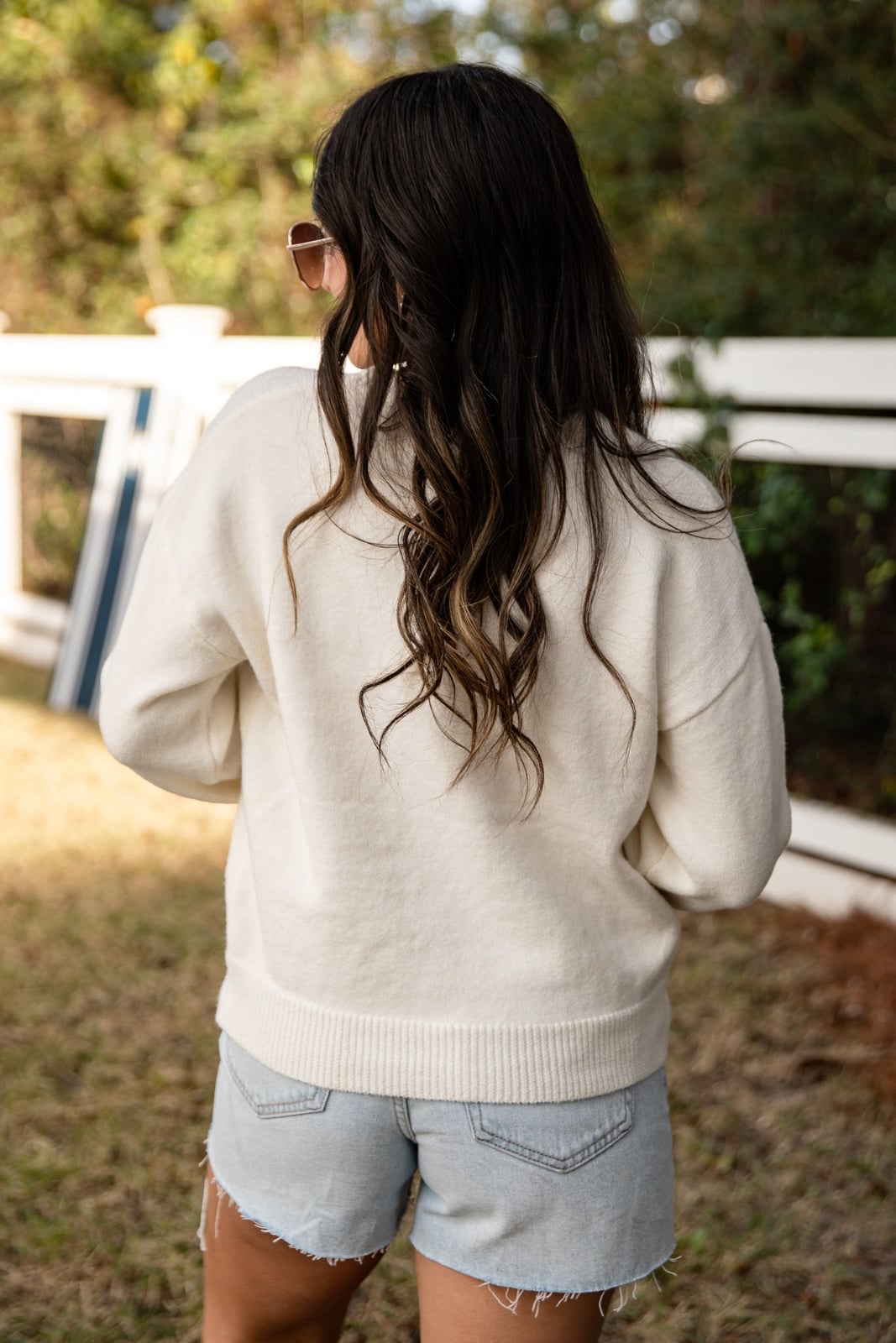 White Ribbed Crewneck Sweater with Denim Shorts White Ribbed Crewneck Sweater with Denim Shorts — Trendy White Sweater Outfit