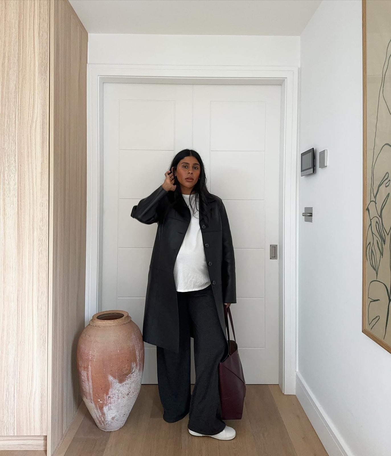 White Tee Under Black Coat With Grey Trousers — Trendy White Tee Outfits