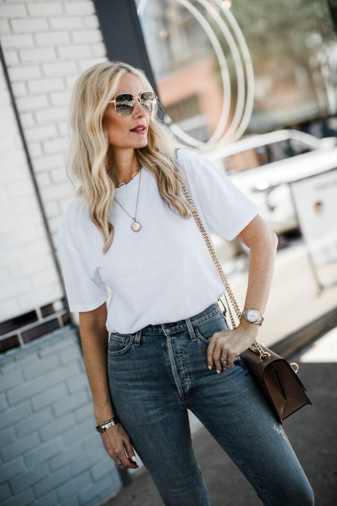 Tucked White Tee With Fitted Jeans And Leather Bag — Trendy White Tee Outfits
