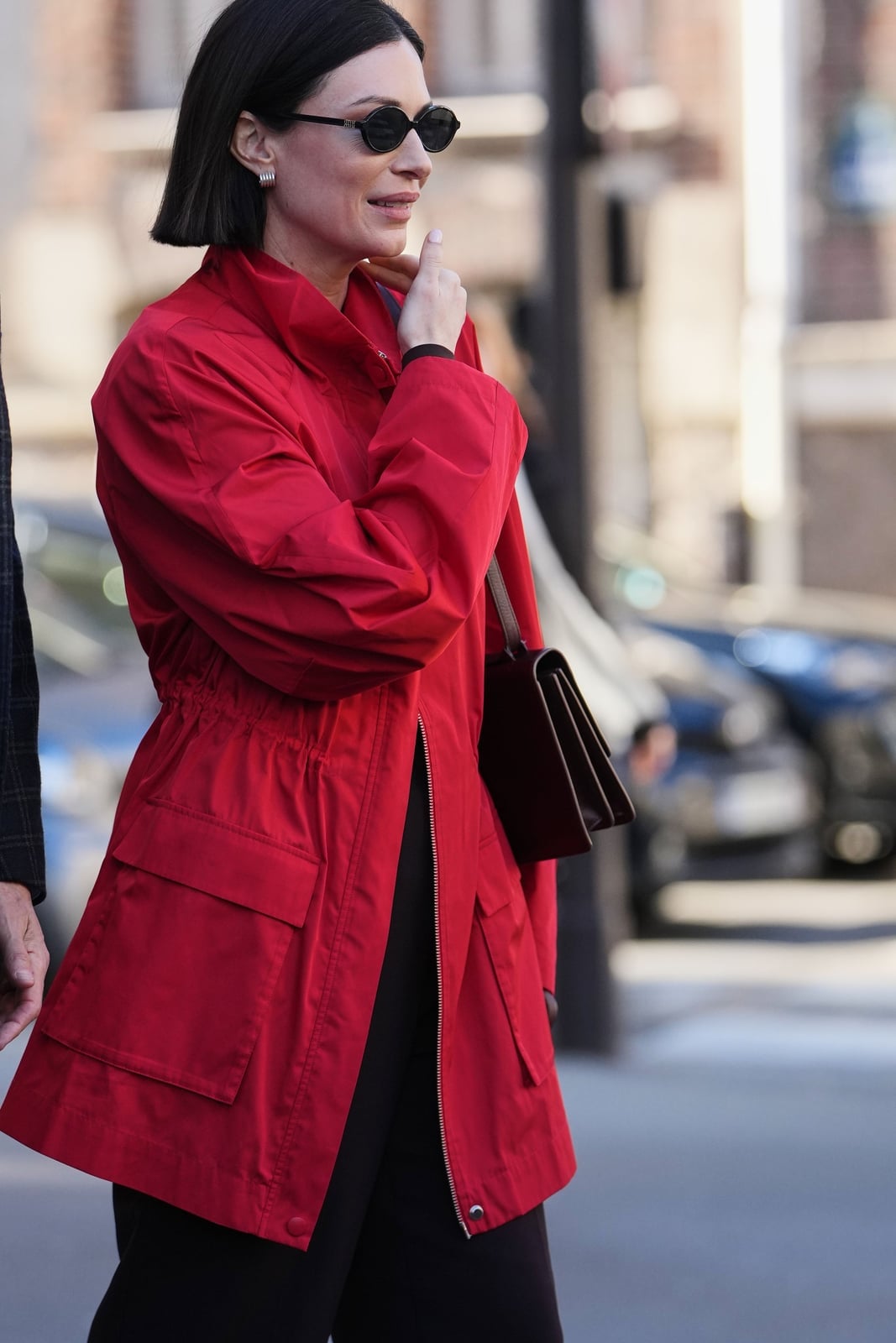 Fitted Red Hooded Windbreaker with Black Garment — Trendy Windbreaker Outfits