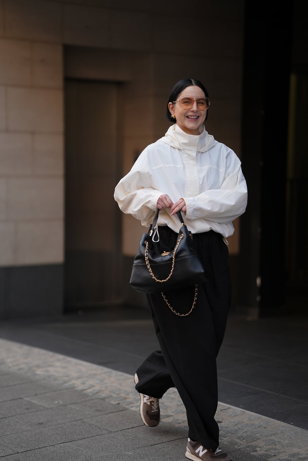 White Oversized Hooded Windbreaker with Relaxed Pants, Close-Up Take — Trendy Windbreaker Outfits