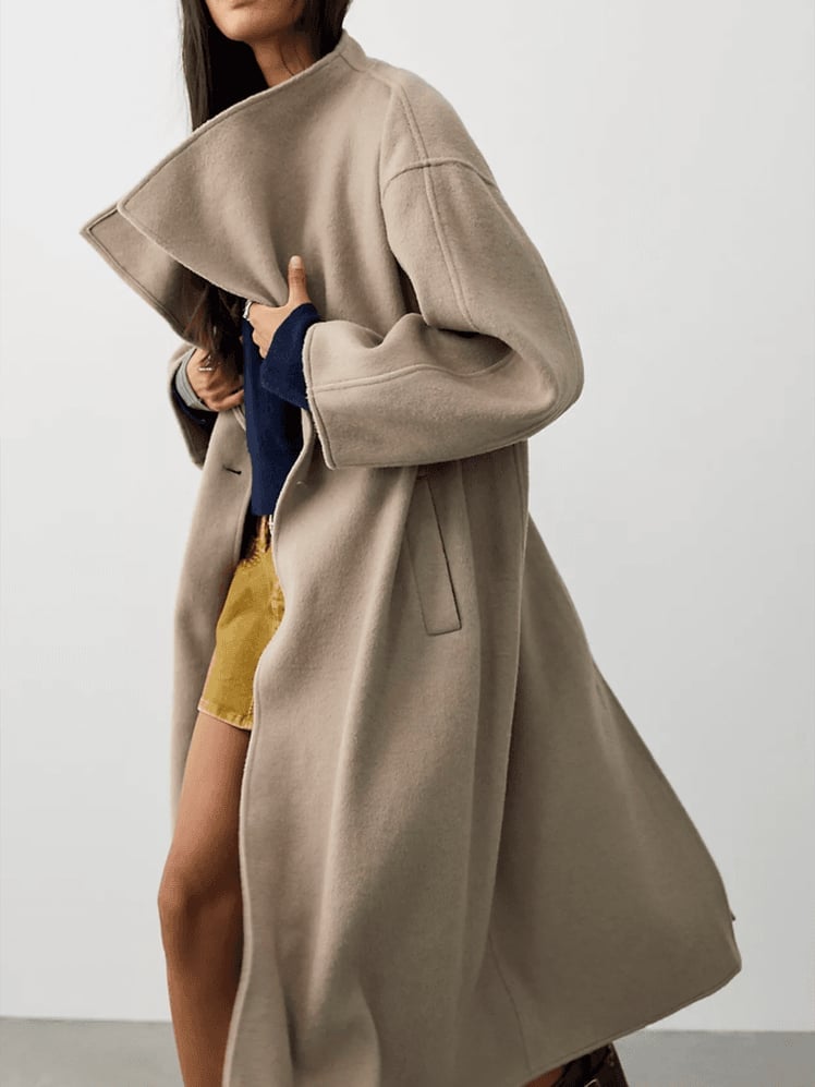 Beige Wool Coat with Dramatic Collar and Shorts and Dark Boots — Trendy Wool Coat Outfits