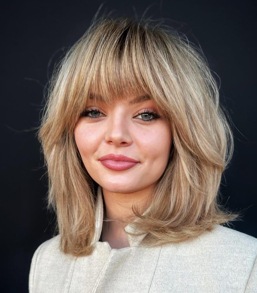 Shoulder Length Blonde Shag With Full Bangs — Trendy Work Hair