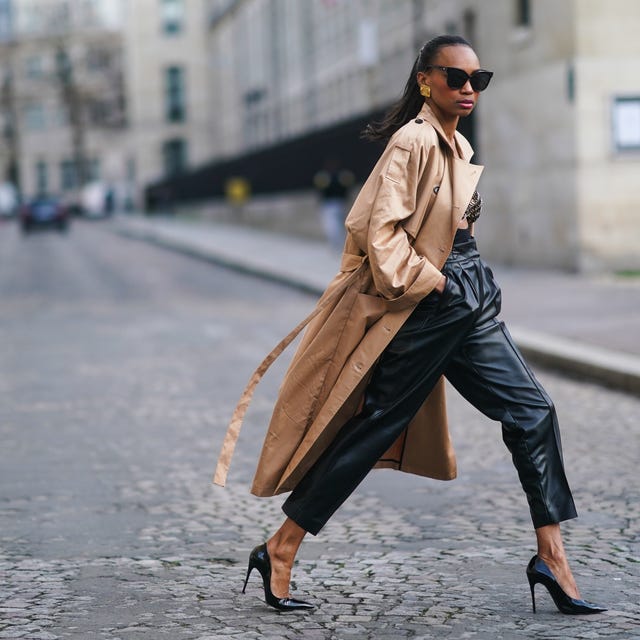 Tan Trench Coat Over Black Leather Trousers With Gold Hoop Earrings Tan Trench Coat Over Black Leather Trousers With Gold Hoop Earrings — Trendy Work Outfits