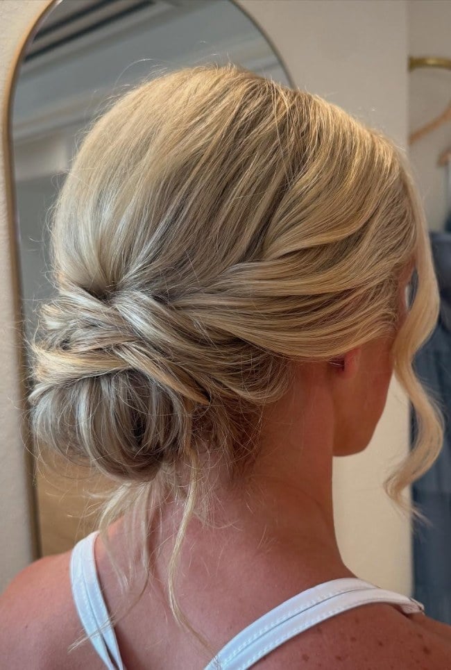 Soft Blonde Twisted Bun With Loose Tendrils, Wavy Soft Blonde Twisted Bun With Loose Tendrils, Wavy — Wedding Bun Ideas