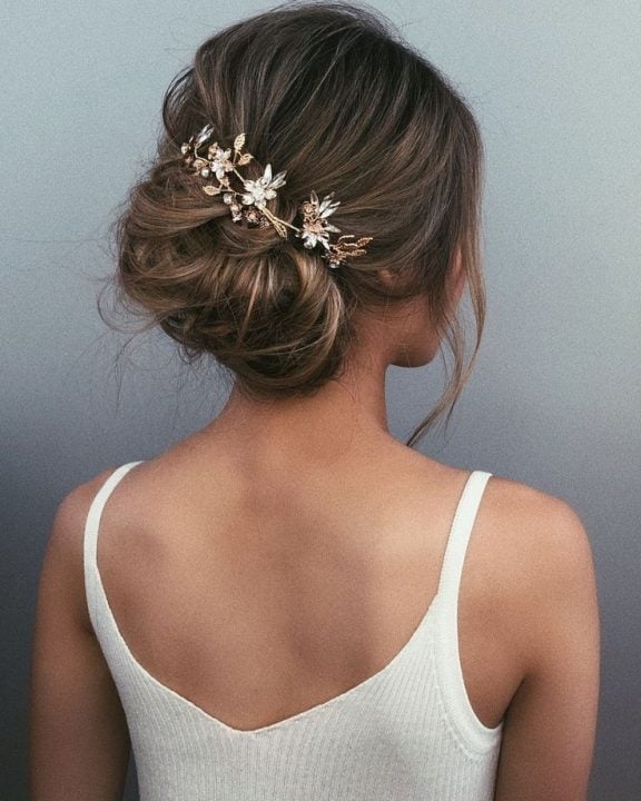 Textured Blonde Bun With Gold Accessory Textured Blonde Bun With Gold Accessory — Wedding Bun Ideas