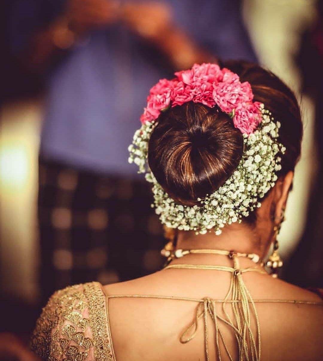 High Dark Brown Bun With Pink Flowers High Dark Brown Bun With Pink Flowers — Wedding Bun Ideas