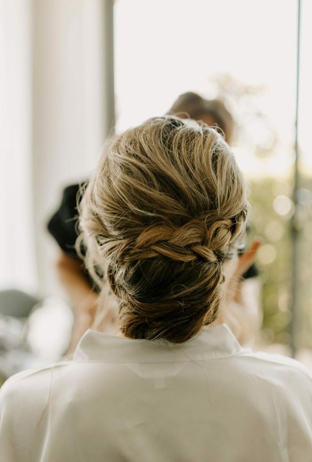 Textured Blonde Updo With Braided Accents Textured Blonde Updo With Braided Accents — Wedding Bun Ideas
