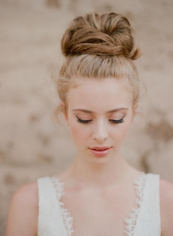 High Blonde Bun With Middle Parting High Blonde Bun With Middle Parting — Wedding Bun Ideas