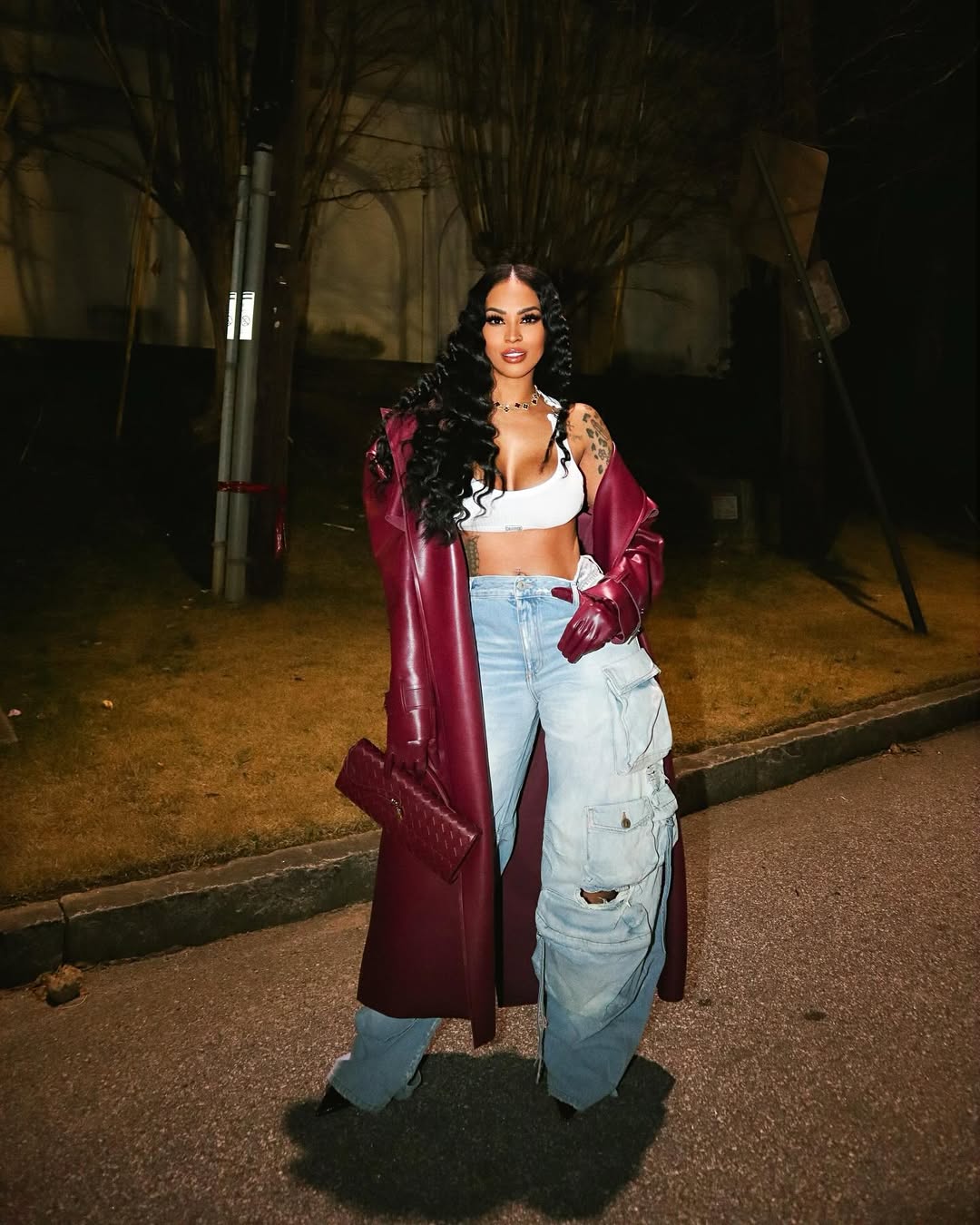 Long Leather Coat Over Crop Top and Baggy Jeans Long Leather Coat Over Crop Top and Baggy Jeans — Y2K Party Outfit Inspiration